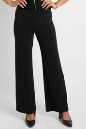 Model Pamela wearing size 10 of The Wide Waistband Basic Pull On Pant in colour Black (Black), from the front, cropped image
