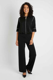 Model Pamela wearing size 10 of The Wide Waistband Basic Pull On Pant in colour Black (Black), from the front, showing the whole outfit