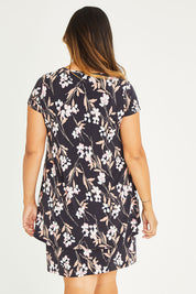 Model Palatina wearing size 16 of The Printed Short Sleeve Rita Dress in colour Blooms (Grey), from the back