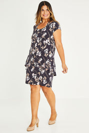 Model Palatina wearing size 16 of The Printed Short Sleeve Rita Dress in colour Blooms (Grey), from the front, showing the whole outfit