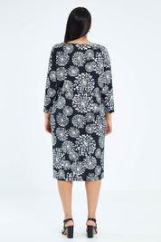 Model Sasha-Lee wearing size 16 of The Lined Jersey Dress in colour Blooms (Black), from the back