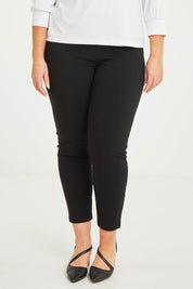 Model Katie wearing size 16 of The Stretch Career Pull On Pant in colour Black (Black), from the front, cropped image