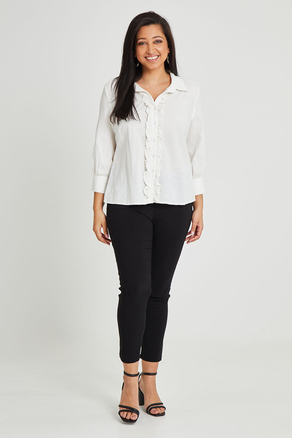 Model Terri-Leigh wearing size 14 of The Stretch Career Pull On Pant in colour Black (Black), from the front, showing the whole outfit