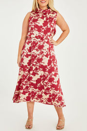 Model Katie wearing size 14 of The Printed Roll Neck Dress in colour Blossom (Red), from the front, cropped image