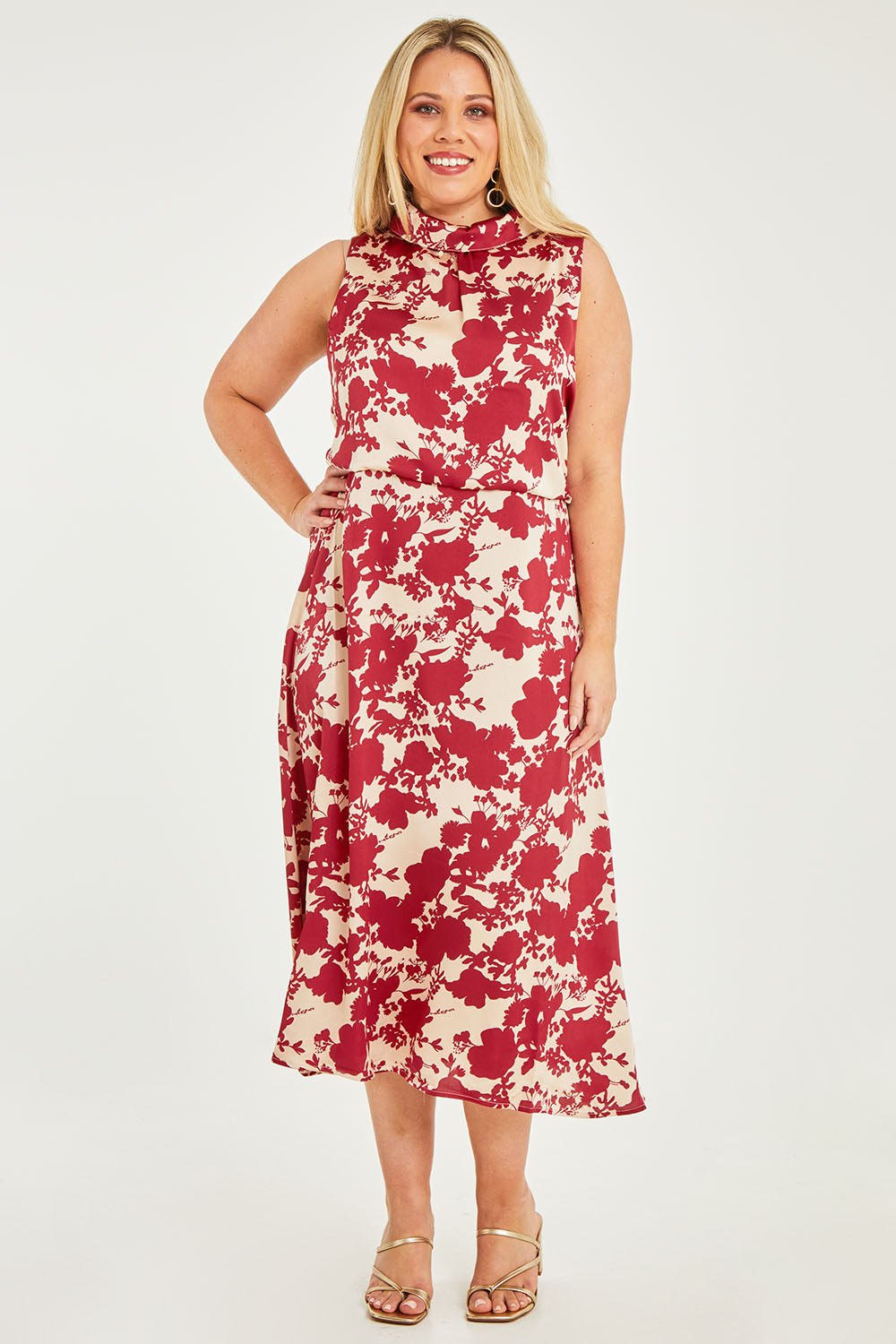 Model Katie wearing size 16 of The Printed Roll Neck Dress in colour Blossom (Red), from the front, showing the whole outfit