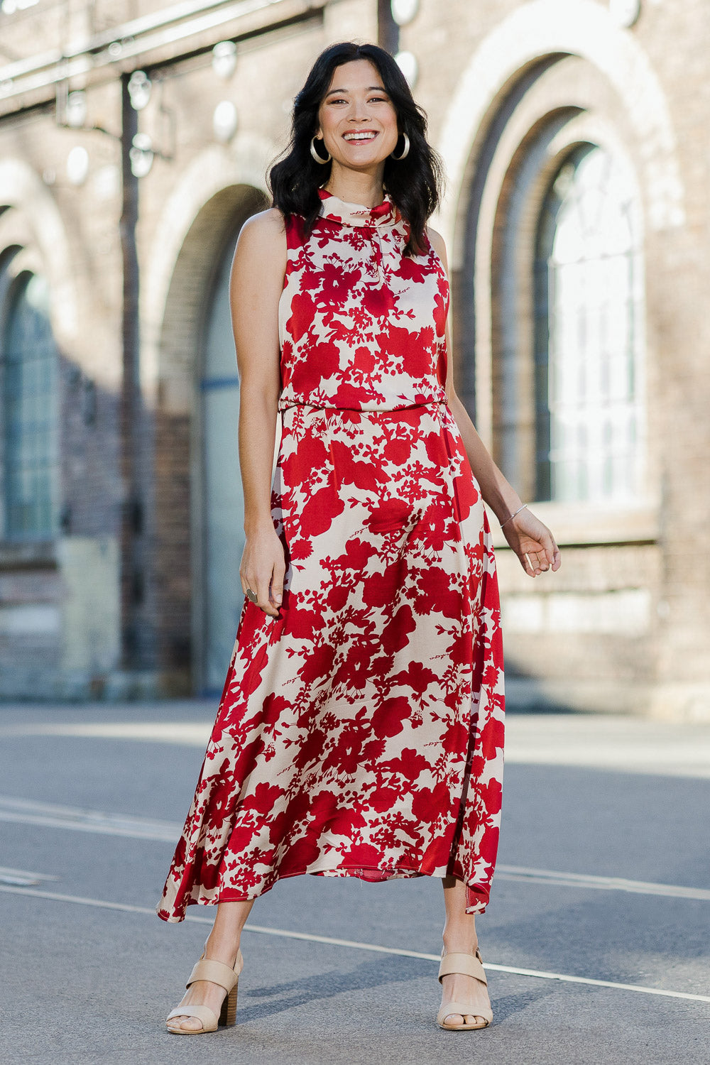 Model Miranda wearing size 10 of The Printed Roll Neck Dress in colour Blossom (Red), from the front, showing the whole outfit