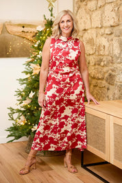 Model Sandy wearing size 10 of The Printed Roll Neck Dress in colour Blossom (Red), from the front, showing the whole outfit