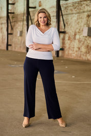 Model Fiona wearing size 16 of The Essential Jersey Pull On Pant in colour Navy (Blue), from the front, showing the whole outfit