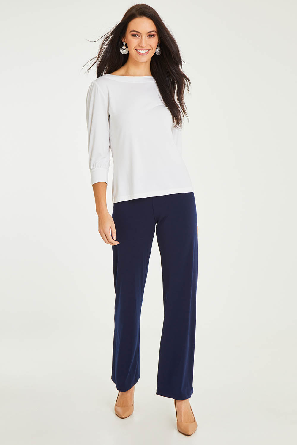 Model Stacey wearing size 10 of The Essential Jersey Pull On Pant in colour Navy (Blue), from the front, showing the whole outfit