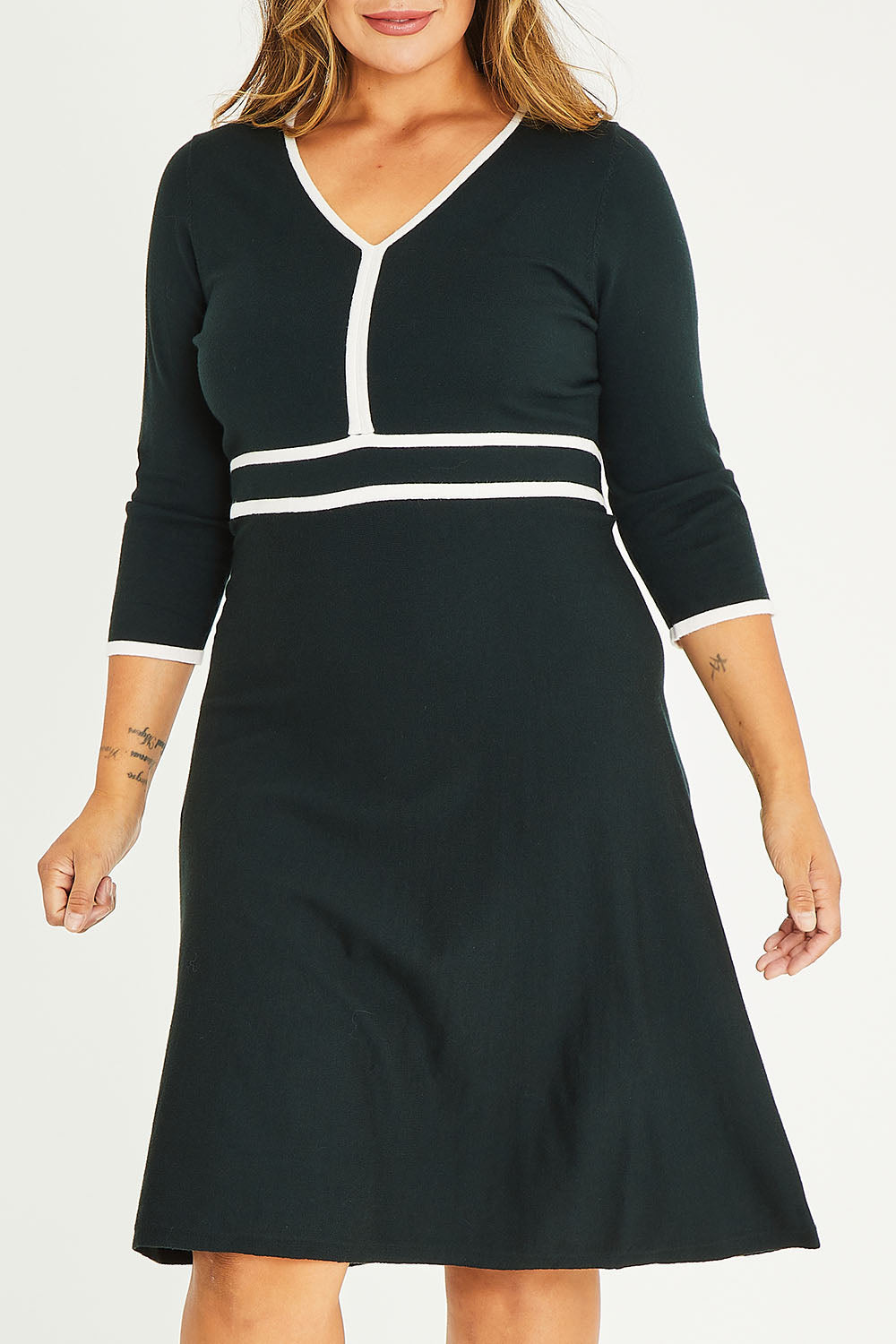Model Palatina wearing size XL of The Contrast Trim Knit Dress in colour Darkpine (Green), from the front, cropped image