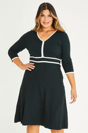 Model Palatina wearing size XL of The Contrast Trim Knit Dress in colour Darkpine (Green), from the front, cropped image