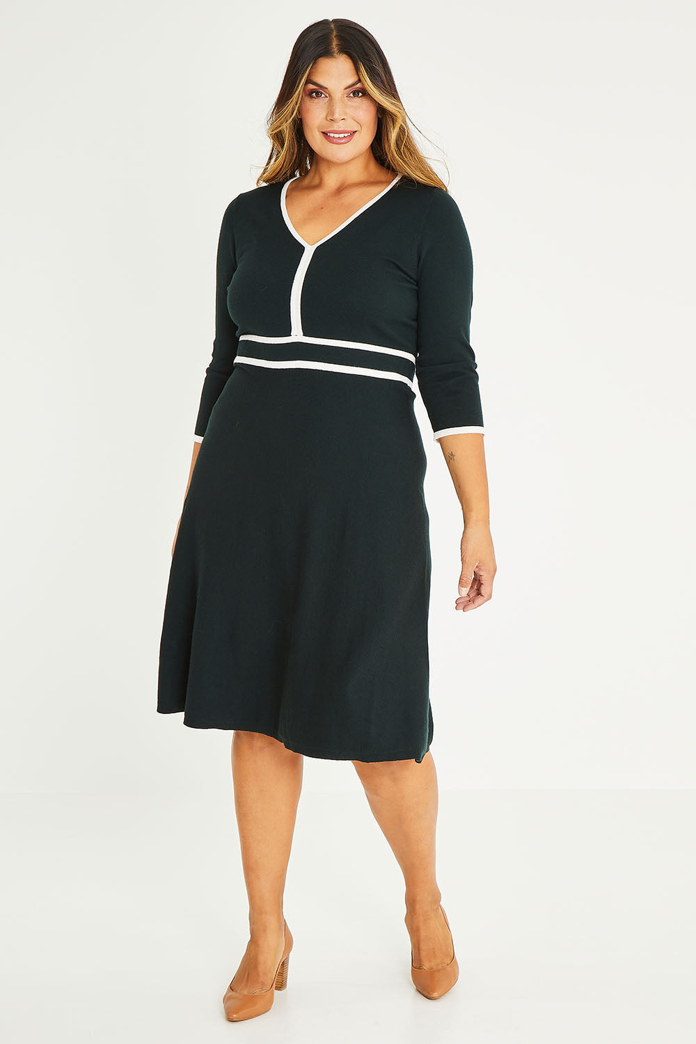 Model Palatina wearing size XL of The Contrast Trim Knit Dress in colour Darkpine (Green), from the front, showing the whole outfit