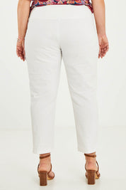 Model Katie wearing size 16 of The Cotton Stretch Pull On Pant in colour Pearl (White), from the back