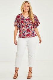 Model Katie wearing size 16 of The Cotton Stretch Pull On Pant in colour Pearl (White), from the front, showing the whole outfit