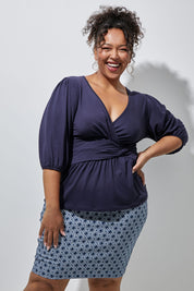 Model Alexis wearing size 16 of The Bamboo Knot Waist Detail Blouse in colour Darknavy (Blue), from the front, showing the whole outfit