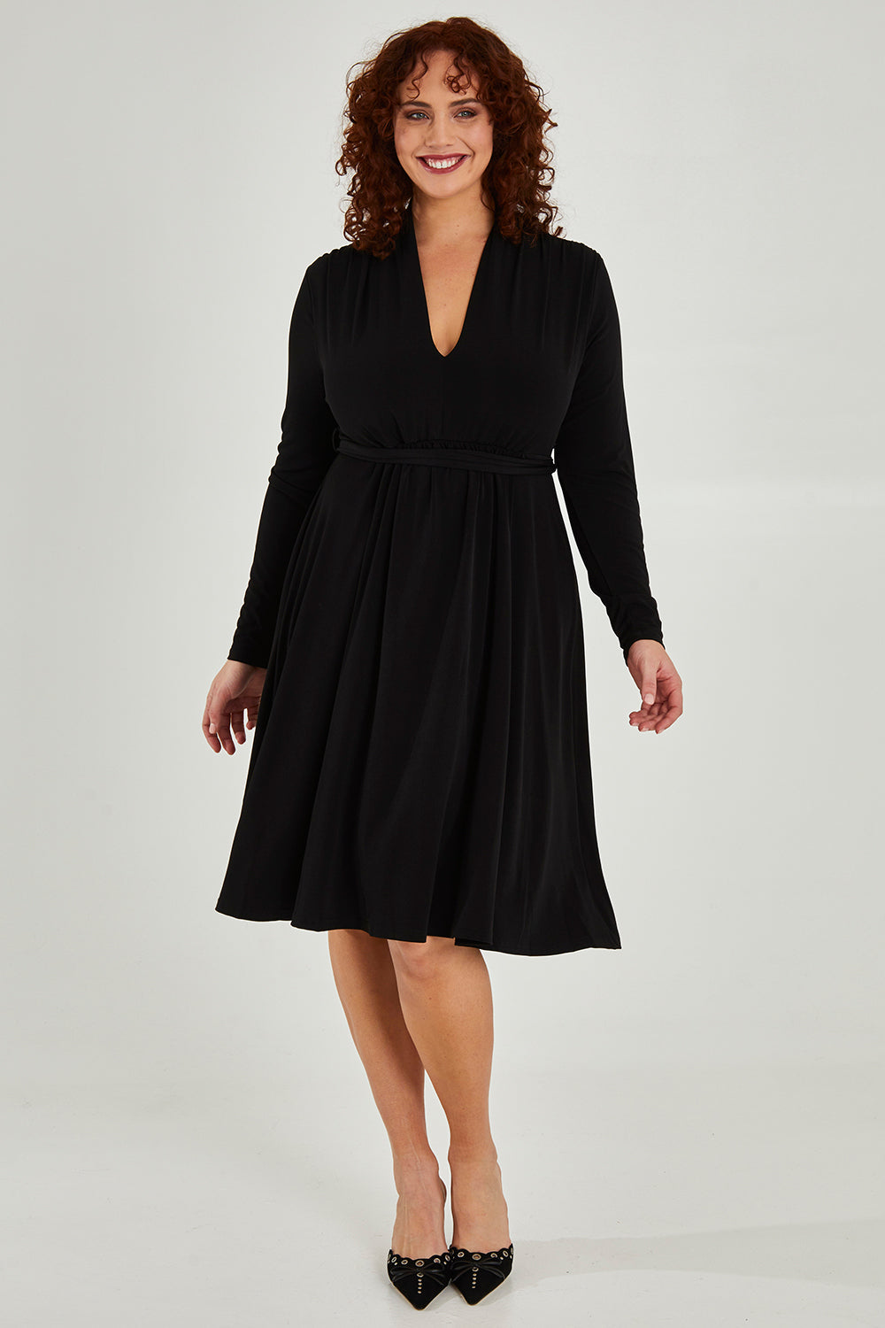 Model Maddy wearing size 16 of The Desk To Date Dress in colour Black (Black), from the front, showing the whole outfit