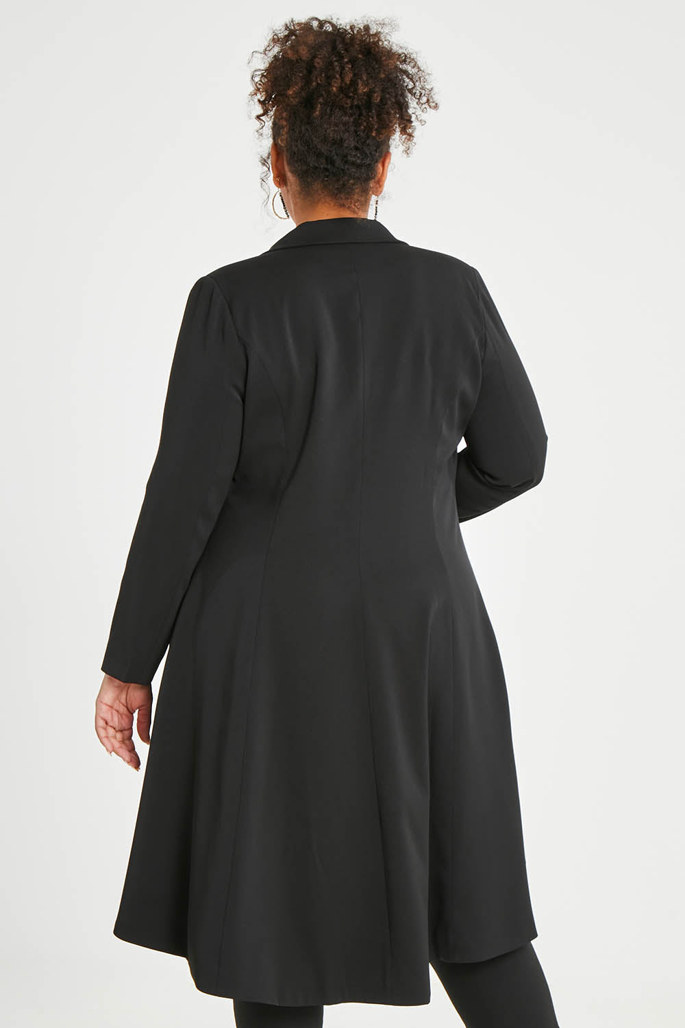 Model Alexis wearing size 16 of The Tailored Longline Jacket in colour Black (Black), from the back