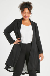 Model Alexis wearing size 16 of The Tailored Longline Jacket in colour Black (Black), from the front, cropped image