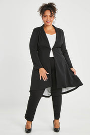 Model Alexis wearing size 16 of The Tailored Longline Jacket in colour Black (Black), from the front, showing the whole outfit