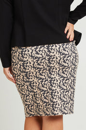 Model Fiona wearing size 16 of The Tube Skirt in colour Inkblot, from the back