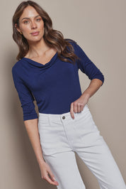 Model Madeline wearing size 10 of The Reversible Cowl Neck Top in colour Deepnavy (Blue), from the front, cropped image