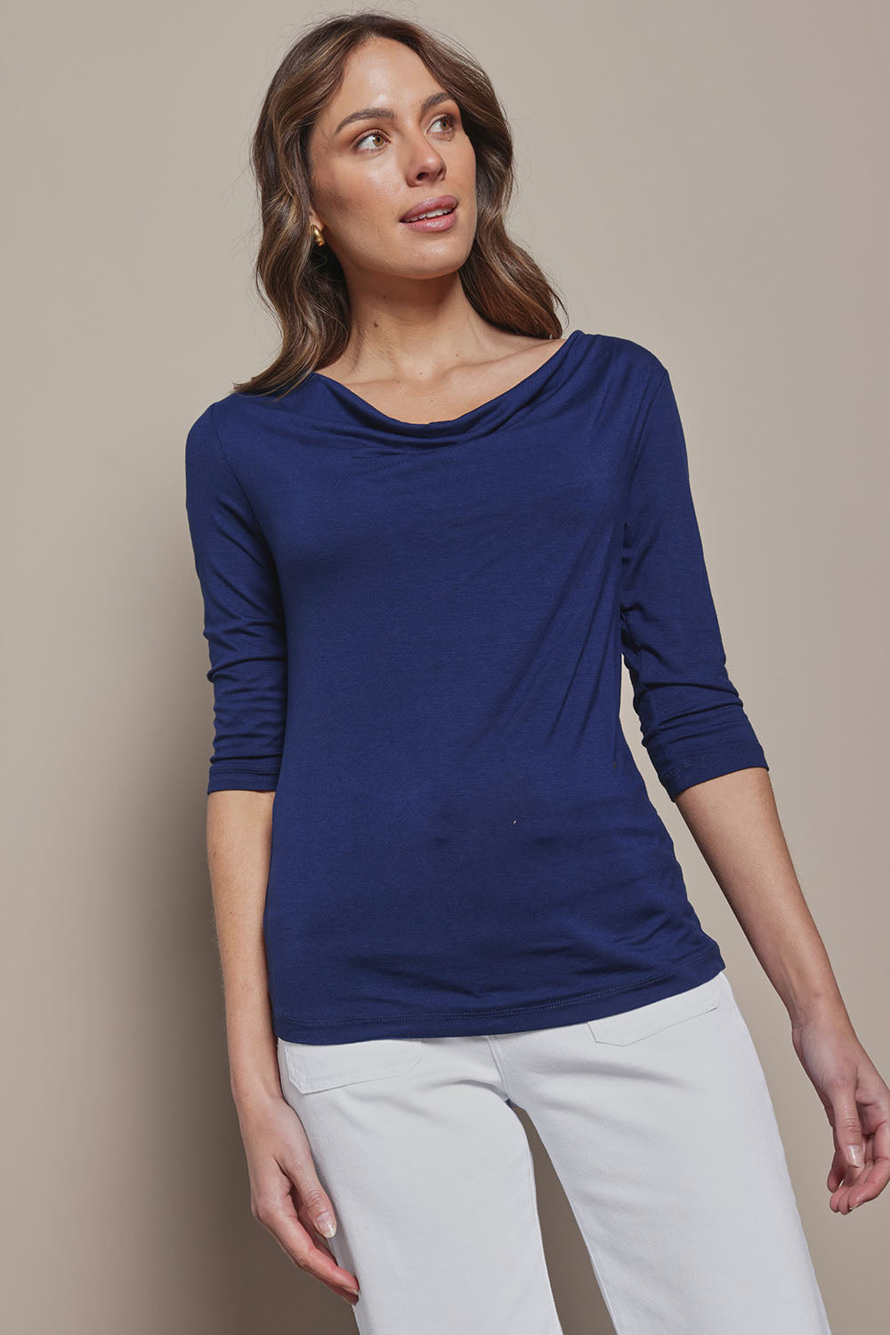 Model Madeline wearing size 10 of The Reversible Cowl Neck Top in colour Deepnavy (Blue), from the front, cropped image