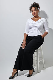 Model Alexis wearing size 16 of The Reversible Cowl Neck Top in colour White (White), from the front, showing the whole outfit
