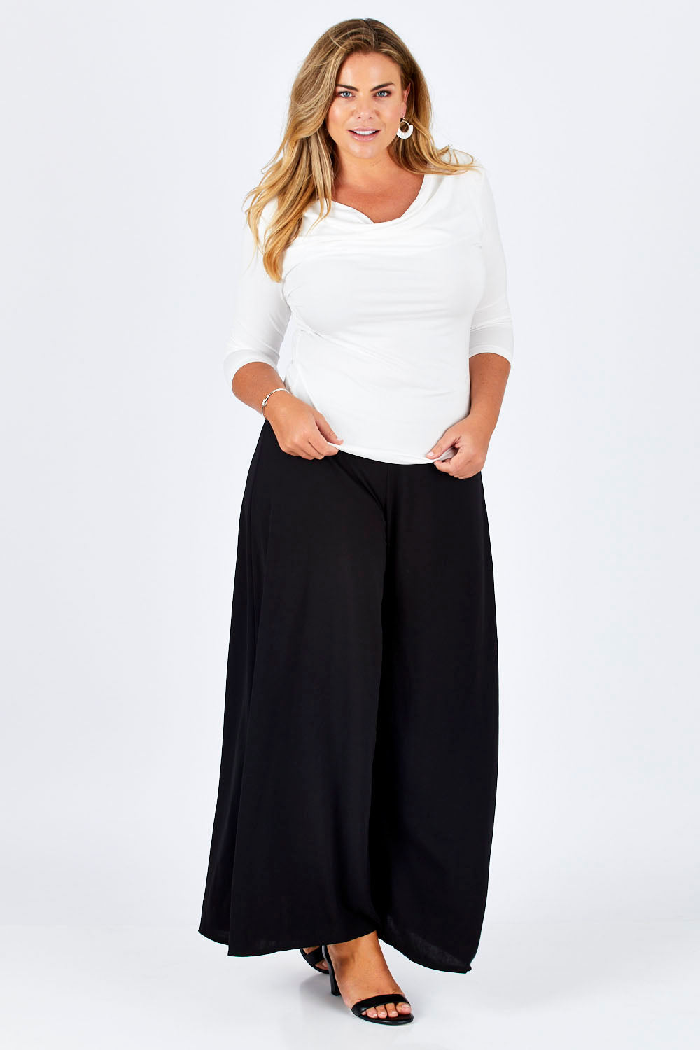 Model Fiona wearing size 16 of The Reversible Cowl Neck Top in colour White (White), from the front, showing the whole outfit