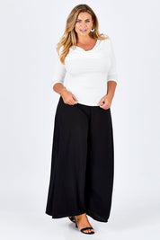 Model Fiona wearing size 16 of The Reversible Cowl Neck Top in colour White (White), from the front, showing the whole outfit