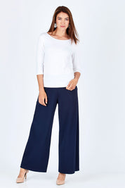 Model Rebecca wearing size 10 of The Reversible Cowl Neck Top in colour White (White), from the front, showing the whole outfit