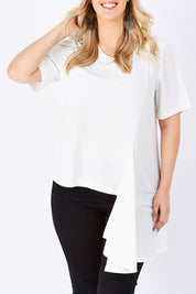 Model Jess wearing size 14 of The Side Panel Drape Top in colour OffWhite (White), from the front, cropped image