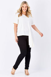 Model Jess wearing size 14 of The Side Panel Drape Top in colour OffWhite (White), from the front, showing the whole outfit