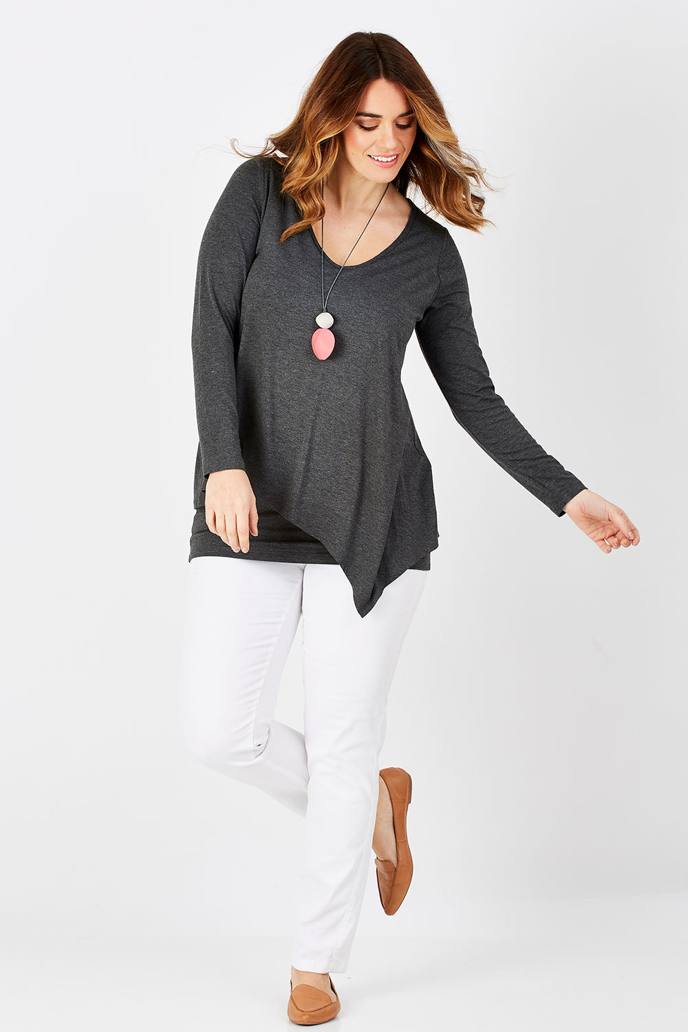 Model Laura wearing size 12 of the Belle V Neck Forgiver Tunic in colour Charcoal (Grey), from the front, showing the whole outfit