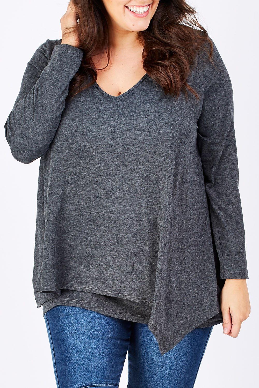 Model Mae wearing size 16 of the Belle V Neck Forgiver Tunic in colour Charcoal (Grey), from the front, cropped image