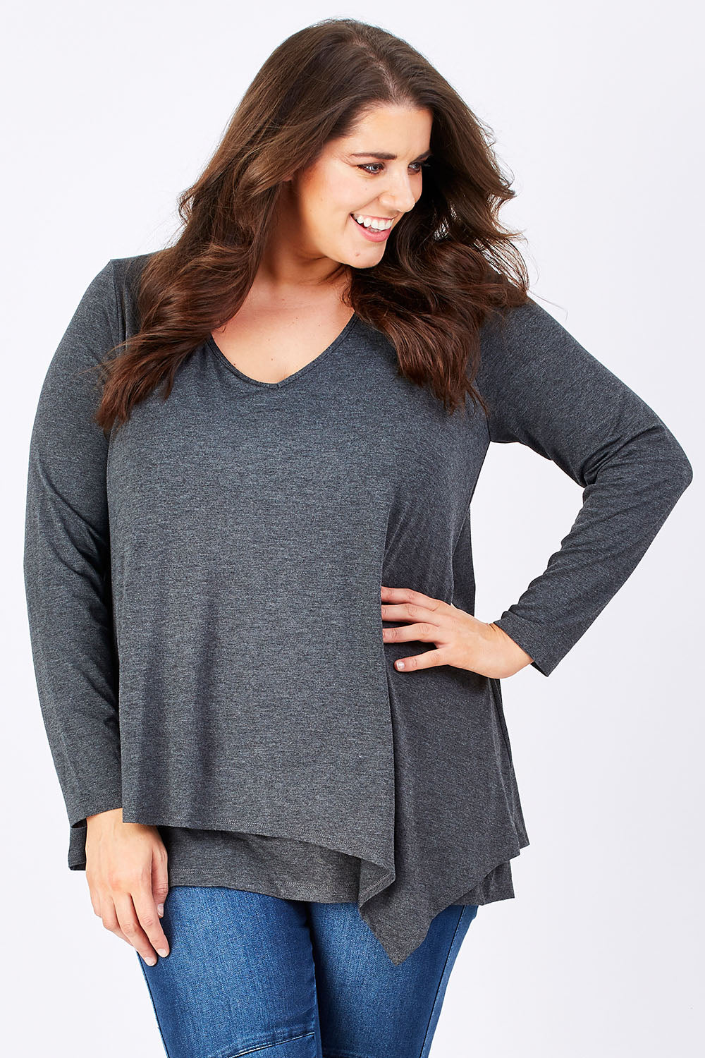Model Mae wearing size 16 of the Belle V Neck Forgiver Tunic in colour Charcoal (Grey), from the front, cropped image