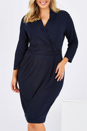 Model Jess wearing size 12 of the Belle Jersey Pockets Dress in colour BluePrint (Blue), from the front, cropped image