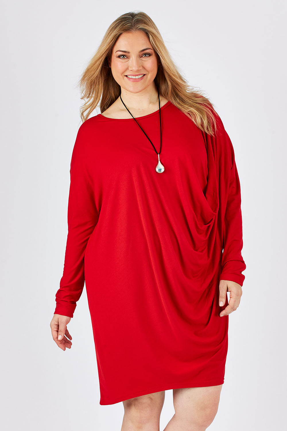 Model Ljubenka wearing size 18 of the Belle Jersey Drapey Dress in colour Red (Red), from the front, cropped image