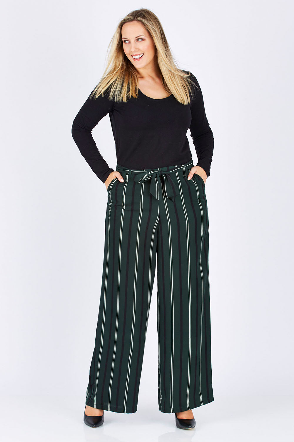 Model Jess wearing size 12 of the Belle Wide Stripe Pant in colour GreenStrip (Green), from the front, showing the whole outfit