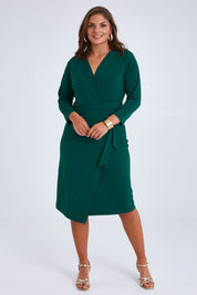 Model Monique wearing size 14 of the Belle Basic Wrap Dress in colour Pine (Green), from the front, showing the whole outfit