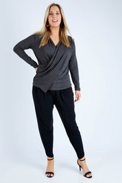 Model Jess wearing size 12 of the Belle Drape Top in colour Charcoal (Grey), from the front, showing the whole outfit