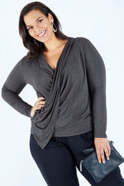 Model Lauren wearing size 16 of the Belle Drape Top in colour Charcoal (Grey), from the front, cropped image