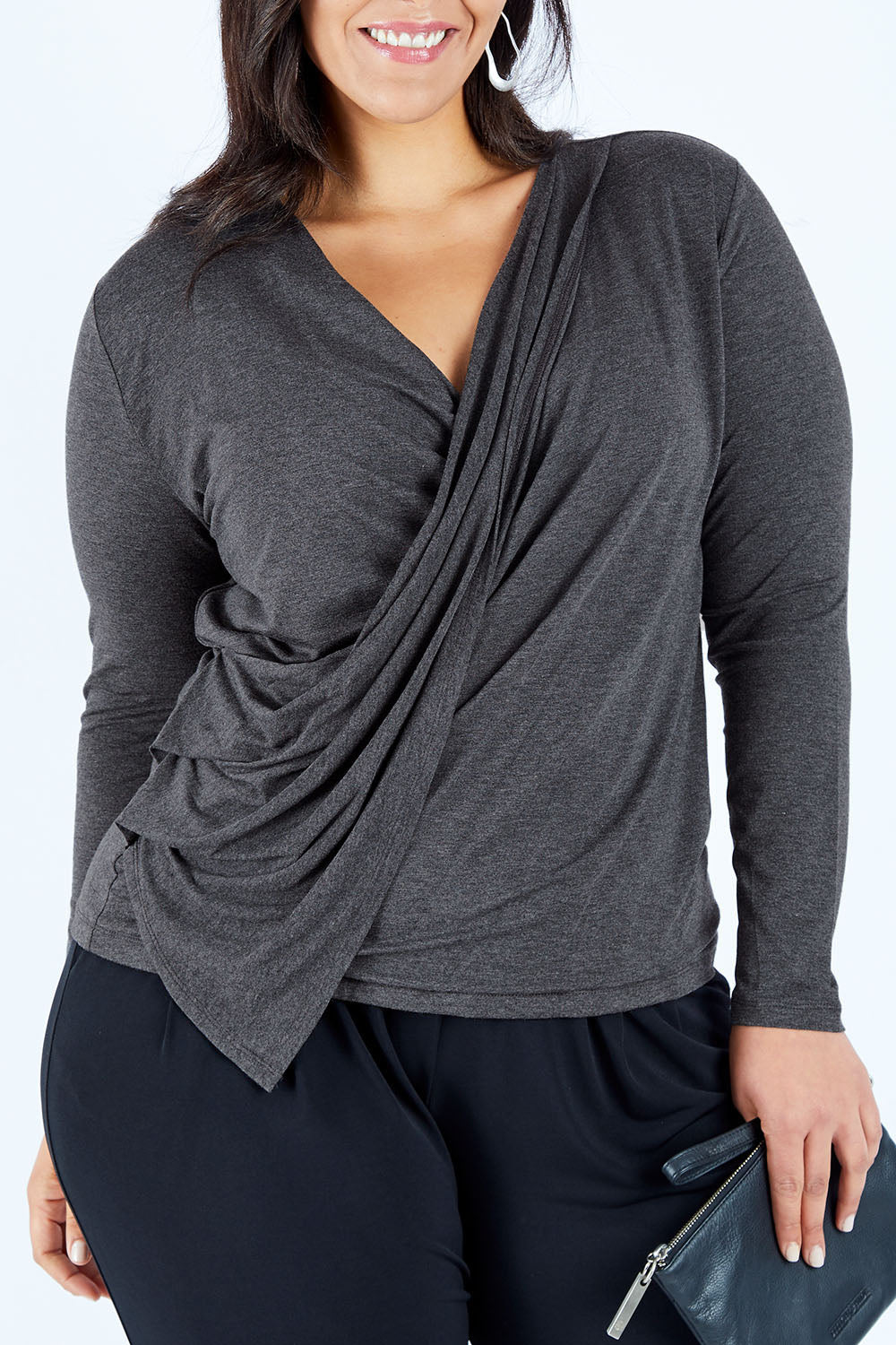 Model Lauren wearing size 16 of the Belle Drape Top in colour Charcoal (Grey), from the front, cropped image
