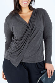 Model Lauren wearing size 16 of the Belle Drape Top in colour Charcoal (Grey), from the front, cropped image