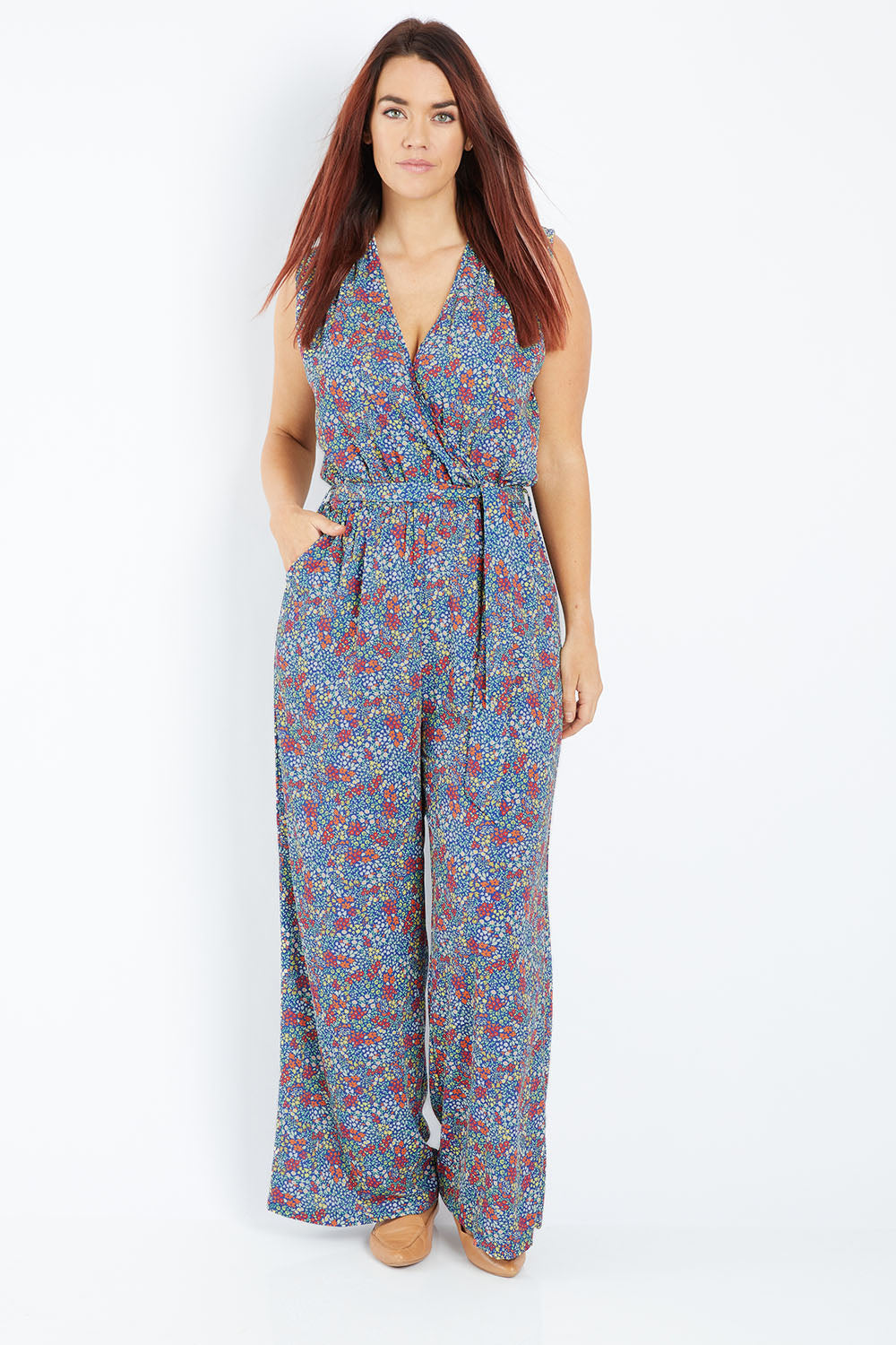 Model Laura wearing size 12 of the Belle Ditsy Floral Jumpsuit in colour Ditsyflora (Blue), from the front, showing the whole outfit
