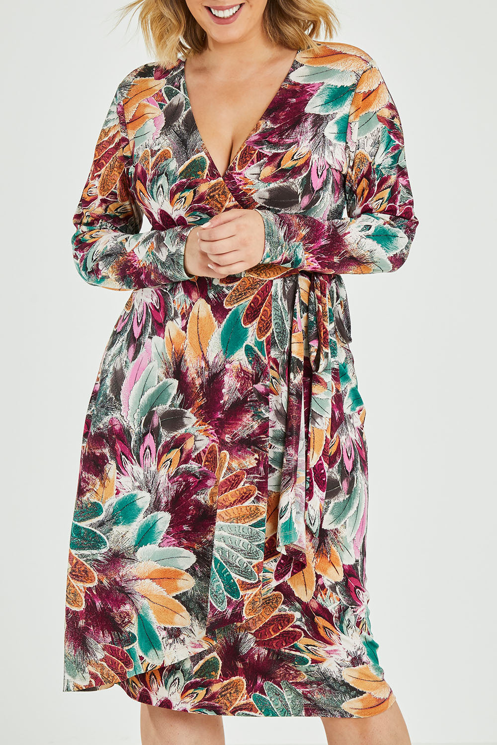 Model Jess wearing size 12 of the Belle Feather Print Wrap Dress in colour Feather (Green), from the front, cropped image