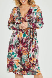 Model Jess wearing size 12 of the Belle Feather Print Wrap Dress in colour Feather (Green), from the front, cropped image