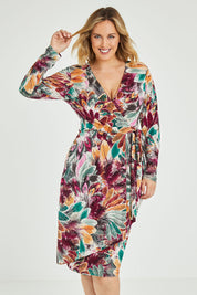 Model Jess wearing size 12 of the Belle Feather Print Wrap Dress in colour Feather (Green), from the front, cropped image