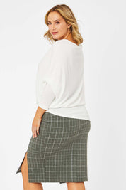 Model Jess wearing size 14 of the Belle Check Cotton Rich Pencil Skirt in colour Check (Green), from the back