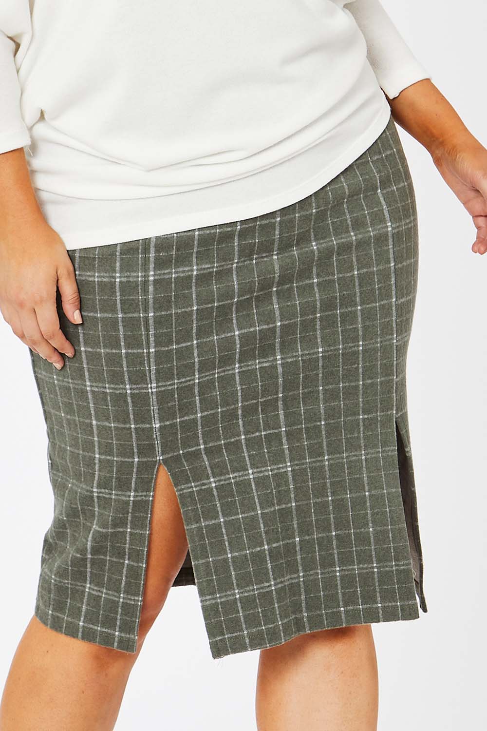 Model Jess wearing size 14 of the Belle Check Cotton Rich Pencil Skirt in colour Check (Green), from the front, cropped image