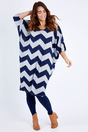 Model Laura wearing size 12 of the Belle Chevron Relaxed Knit Dress in colour Navychev (Blue), from the front, showing the whole outfit